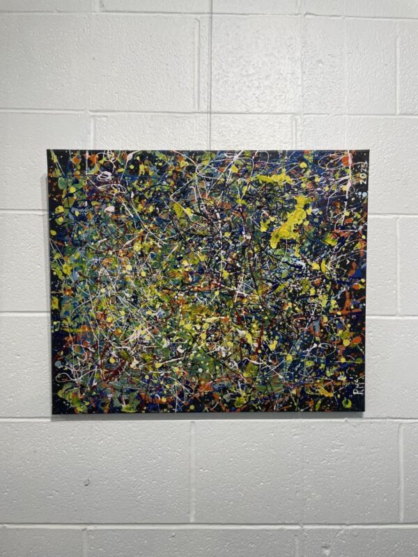 Abstract picture, colours are green, yellow, black and specks of white.