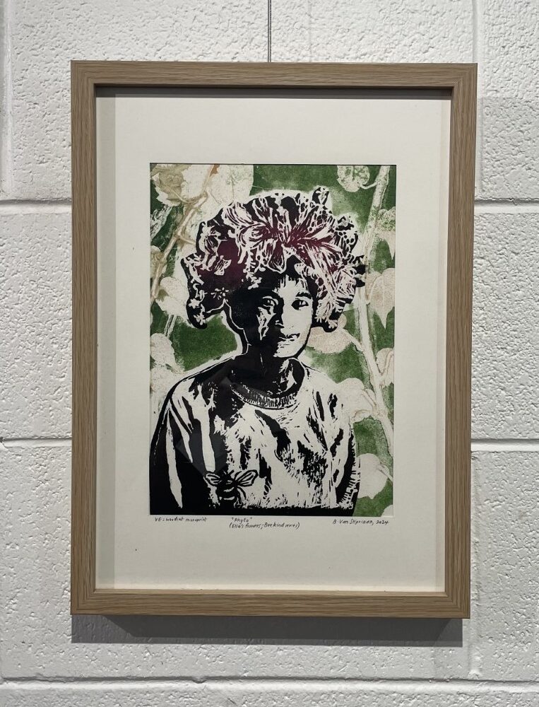 A print of a woman with a colourful headdress