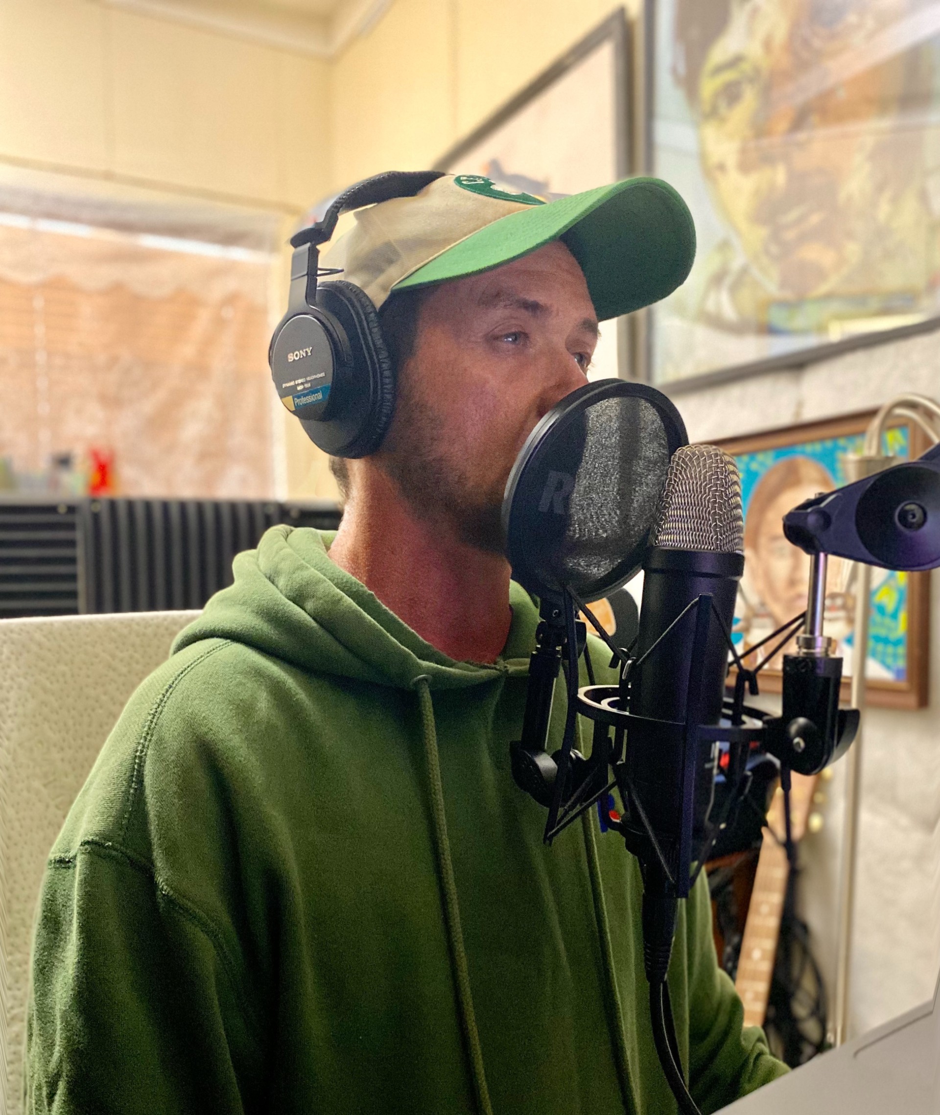 Sam RB singing in a recording studio