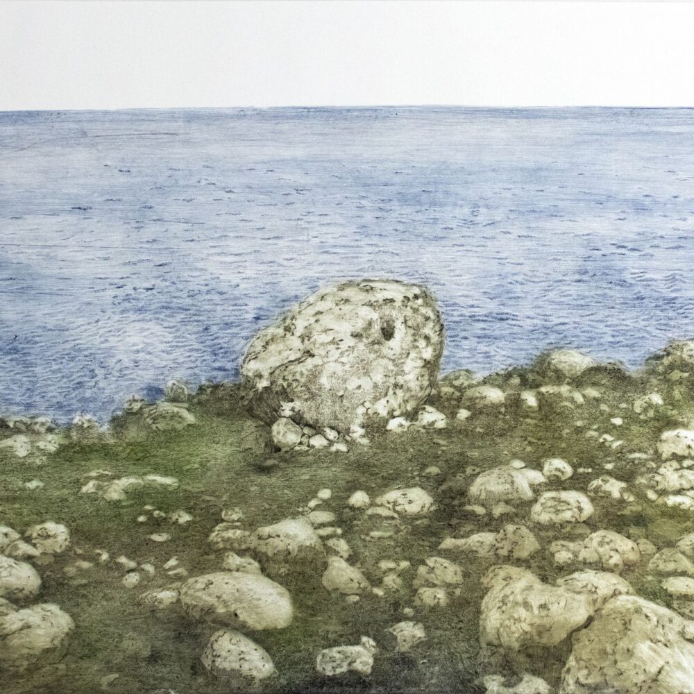 Supported by the stones by Adrian Moss. Bank with stones and a body of water.