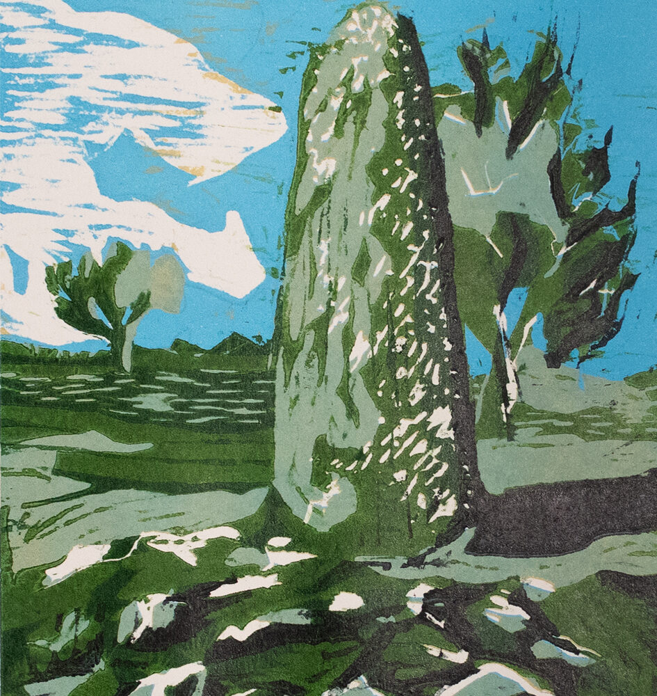 Untitled Rock by Jon-Paul Moses. Rock with green moss and bluesky.